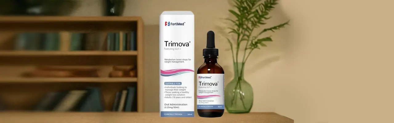 A bottle of Trimova medication sits on a wooden table next to a vase of flowers. The bottle has a red label with white text that says FortiMed Trimova.